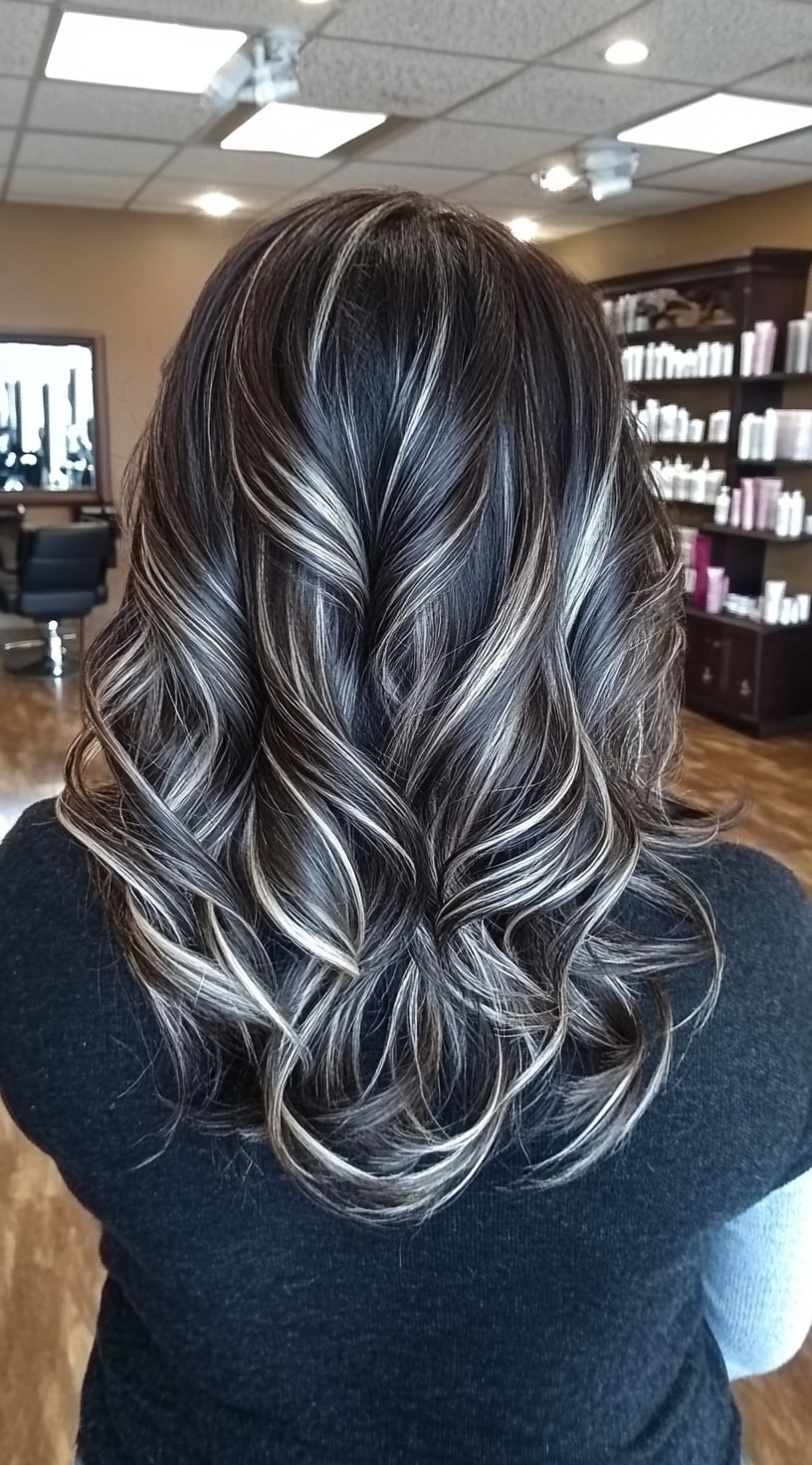 7. Dark Brown Curls with Silver Highlights